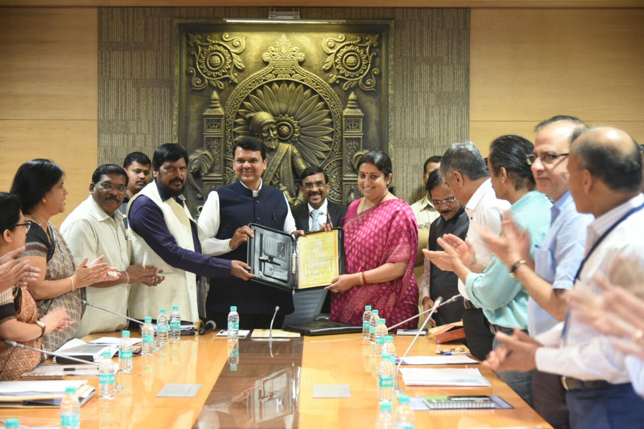 The Honorable Textile Minister Smt. Smriti Zubin Irani handed over NTC Indu Mill No. 6 to The Honorable Chief Minister Maharashtra Shri Devendra Fadnavis for construction of Babasaheb Ambedkar Memorial. Shri P C Vaish, Chairman and Managing Director, NTC Ltd and other senior officials were present on the occasion.